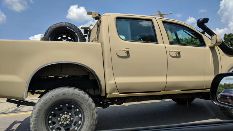 Illustration for article titled Check Out This Militarized Toyota Hilux and Its Weird Door Handles